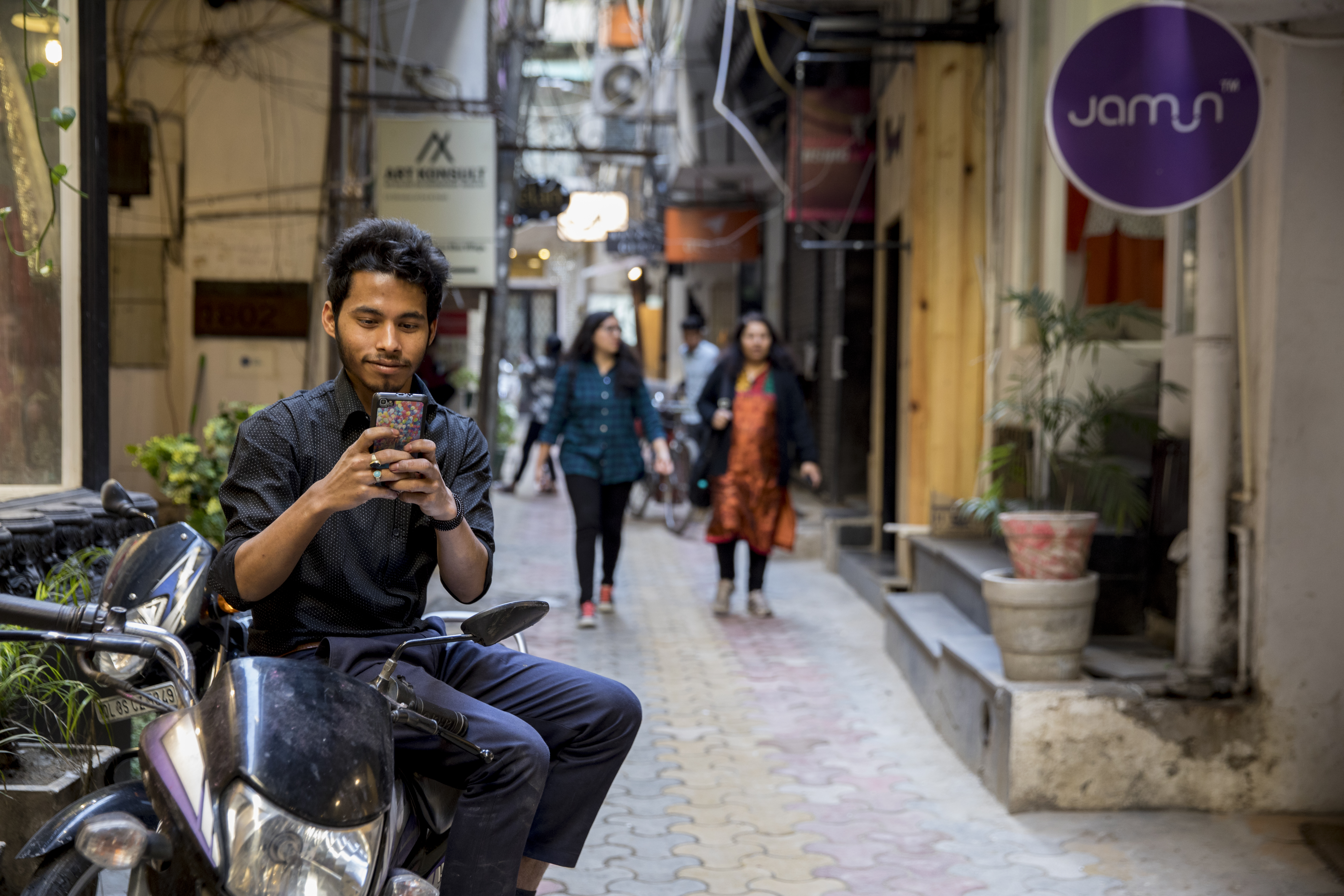 Photo of man using smart-phone.