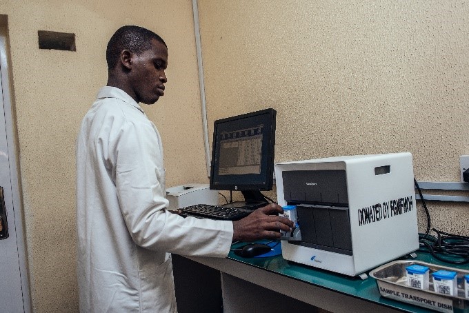 Man using the GeneXpert machine
