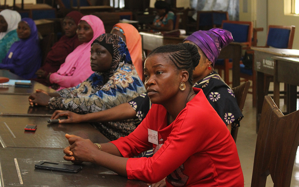 Female participant at a training listening carefully.