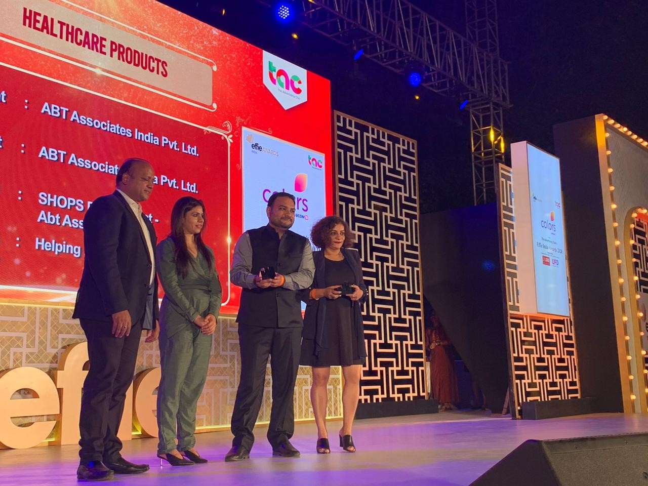 Team members from the SHOPS Plus project in India accepting a Silver Effie award.