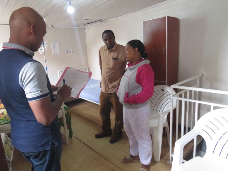 Henitsoa Razafindrakoto of SHOPS Plus visits the hospital room Dr. Randrianarison expanded with her husband Dr. Rakotozafy.