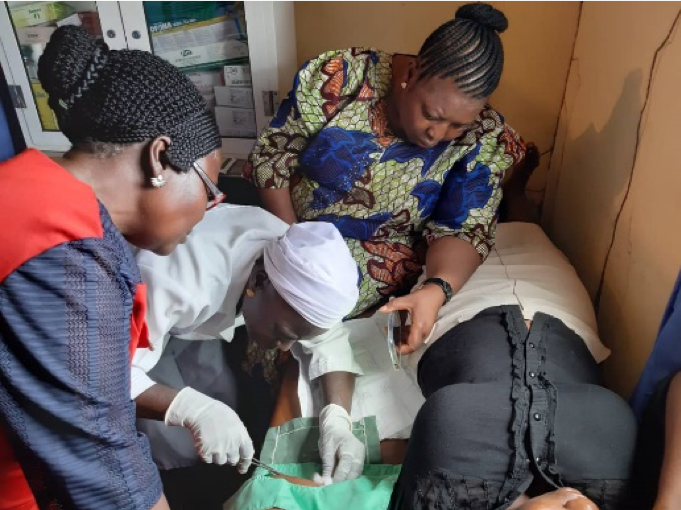 Training on how to put in an implant with a patient.
