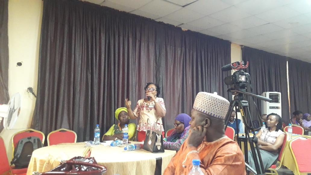 Participant asking a question during the event