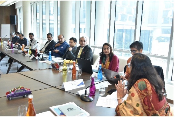 A group of people in a large conference room