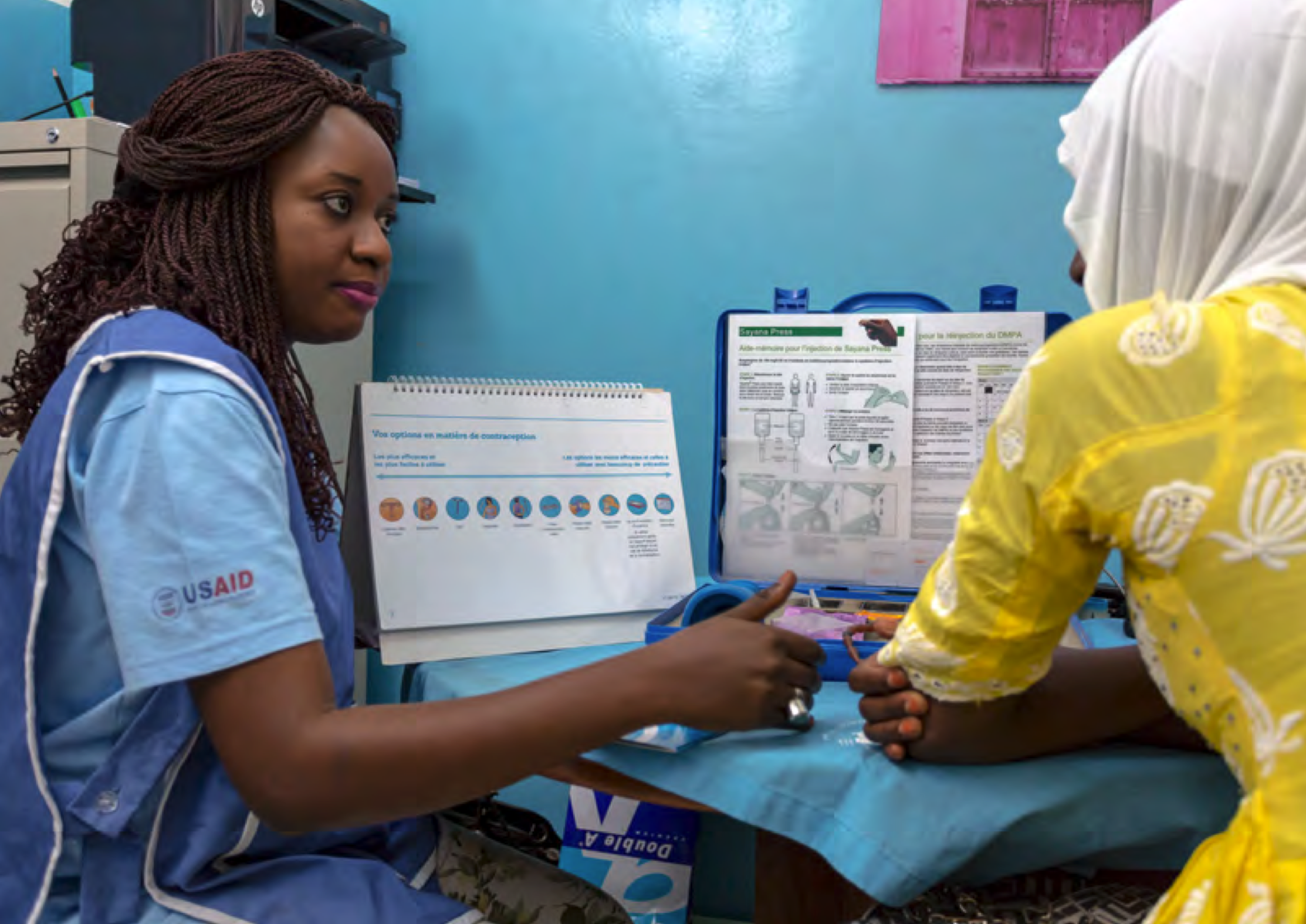 Medical professional taking to a patient