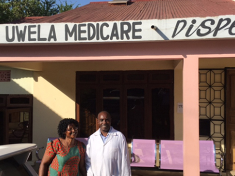 Man and woman standing in front of dispensary.