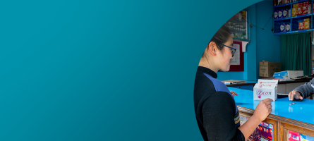 A teal banner with a photo on the right with a young women helping a customer in a drug shop
