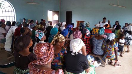 Large group of training participants listen to the speaker in Nigeria
